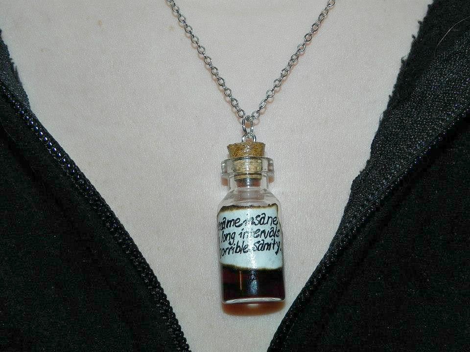 poe_insanity_human_heart_necklaces_2.jpg