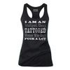I am an intelligent classy tattooed woman who says fuck a lot tank top tanks tops and camis