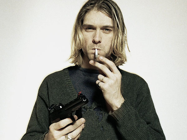Oversized worn sweaters a re a staple of grunge fashion, as demonstrated by Kurt Cobain